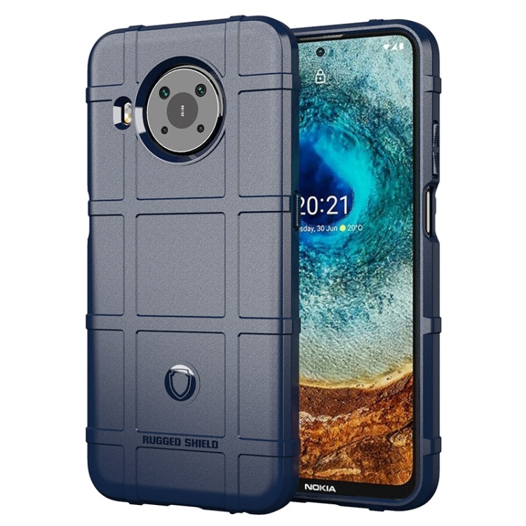 Rugged shockproof TPU phone case in dark blue with textured grip and camera cutout
