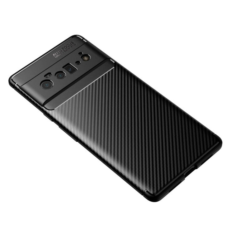 Black carbon fiber texture TPU phone case with raised camera cutout panel.