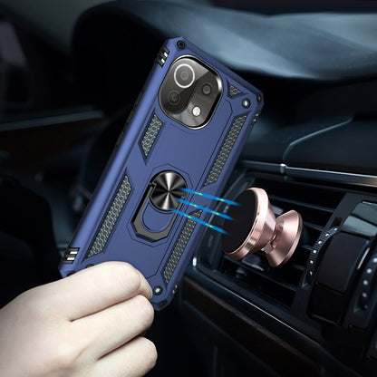 Blue phone case with rotating ring holder clipped to a car air vent.