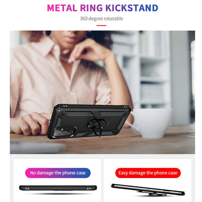 Black rugged phone case with metal ring kickstand on a tabletop
