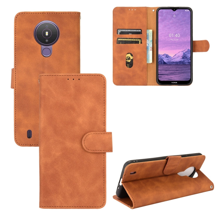Brown PU leather flip phone case with magnetic buckle, card slots, and camera cutout
