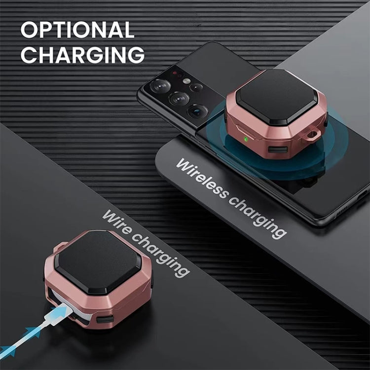 Rose pink earbud case with black lid on wireless charging phone
