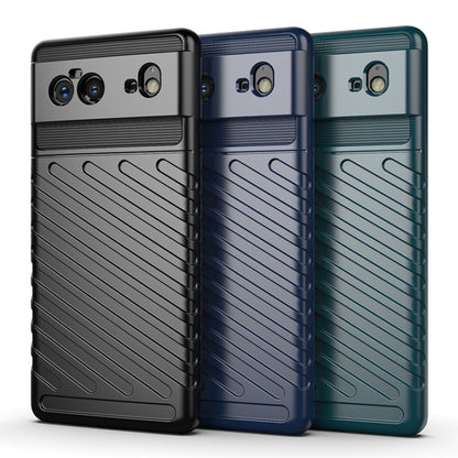 Set of TPU phone cases in black, blue, and green with textured grip panels.