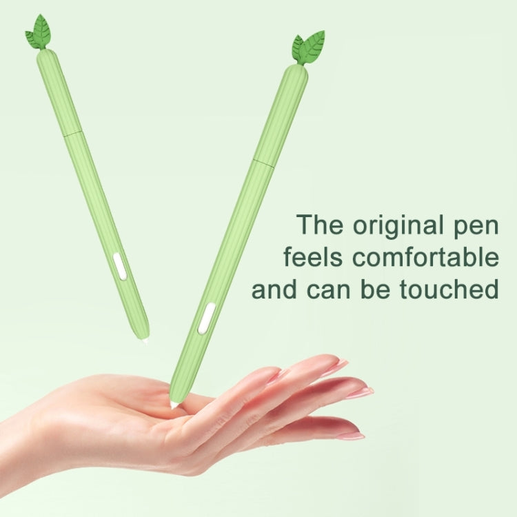 Green silicone fruit-shaped stylus protective cases, leaf tips, in hand