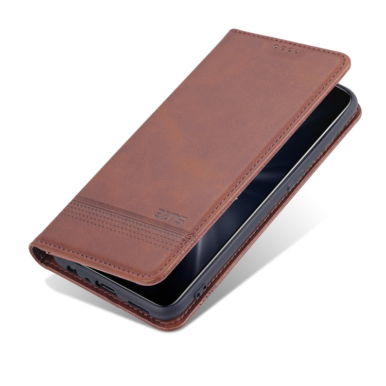 Brown leather flip phone case with flap open and phone secured