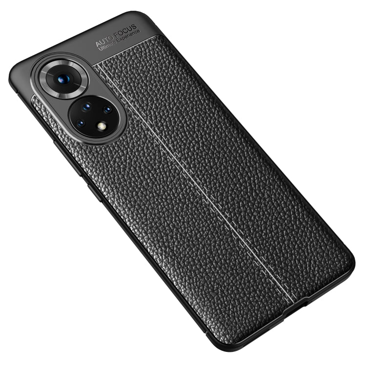 Shockproof TPU phone case with litchi-texture finish, black, angled back view.