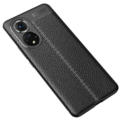 Shockproof TPU phone case with litchi-texture finish, black, angled back view.