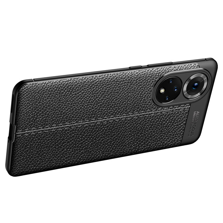 Shockproof TPU phone case with litchi-texture, black, slim profile and camera bump.
