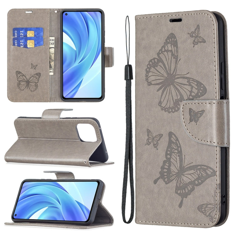 Gray PU leather phone wallet case with embossed butterfly pattern, flip cover and card slot.