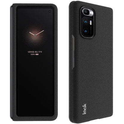 Black IMAK hard phone case with raised edge and textured grip backing
