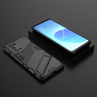 Black rugged 2-in-1 phone case lying flat, showing shockproof TPU shell