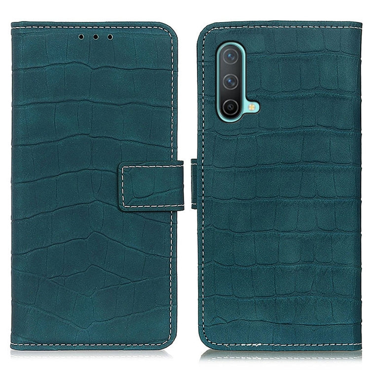 Teal leather flip phone case with crocodile texture, front flap, and side button cutout