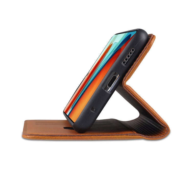 Leather flip phone case with card slot design, black with brown edges; stand view