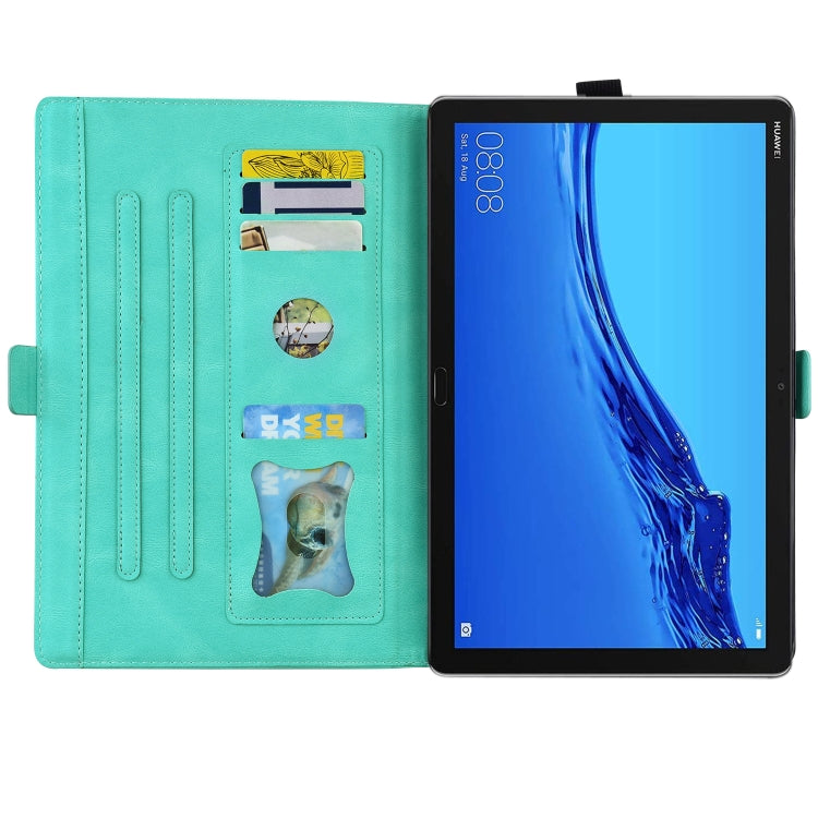 Teal leather folio with card slots and butterfly design, showing tablet screen