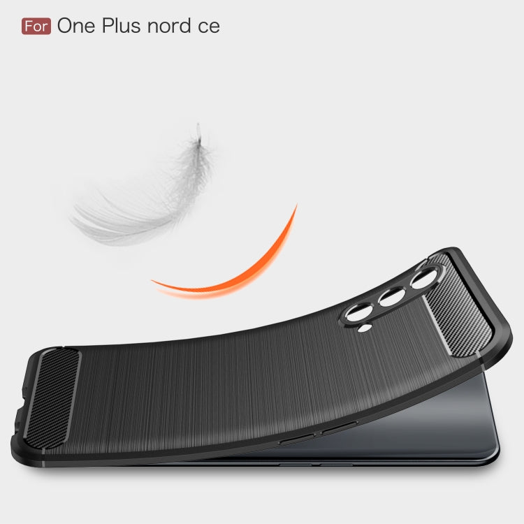 Black carbon fiber TPU phone case with textured side grips and triple camera cutout.