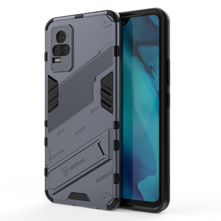 Gray shockproof phone case with rugged armor pattern, raised edges, built-in holder