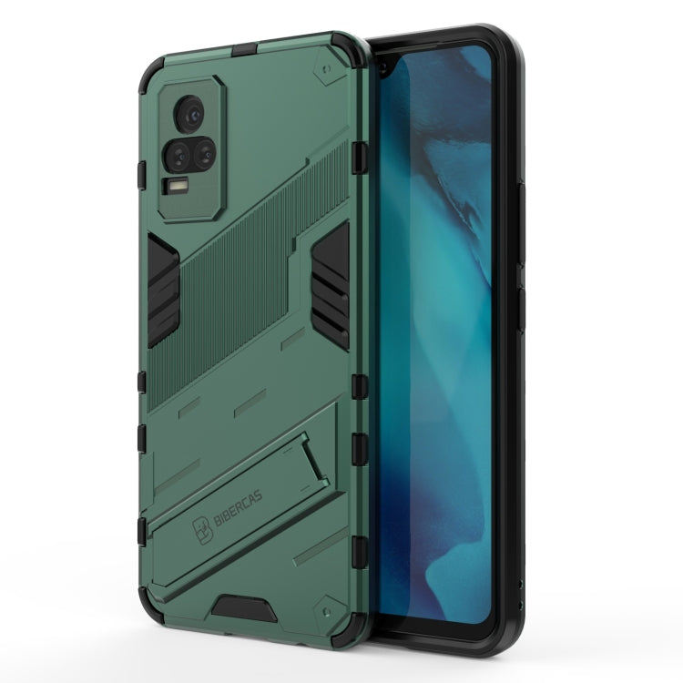 Green shockproof phone case with rugged armor pattern, raised edges, built-in holder