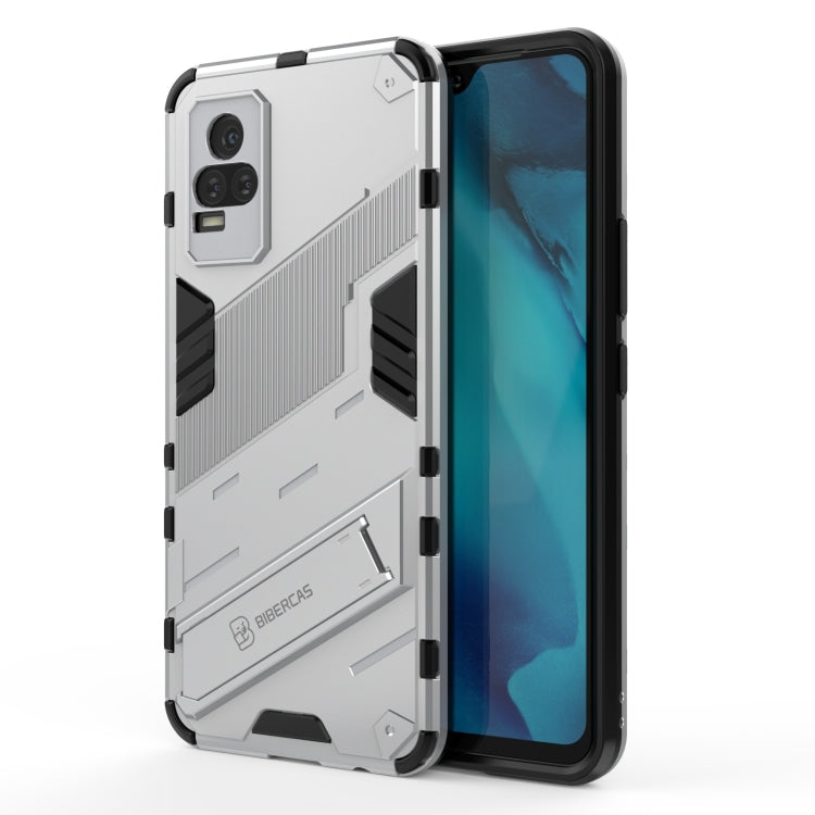 White shockproof phone case with rugged armor design, raised edges, built-in holder