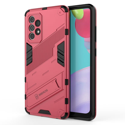 Red armor phone case with textured grip, black edges, and triple camera openings