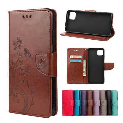 Brown leather flip phone case with butterfly floral pattern and card holder pocket