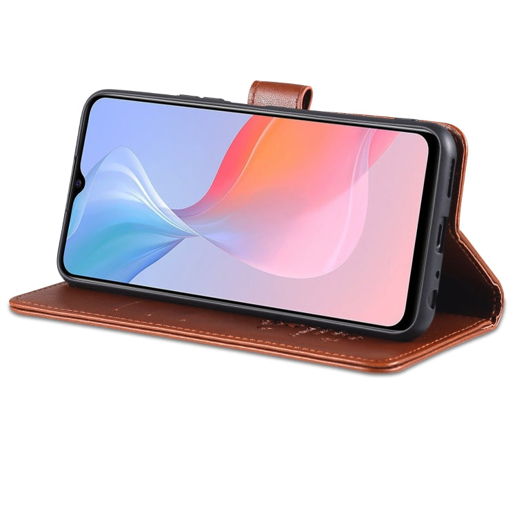 Brown flip leather wallet case with kickstand fold, phone held in landscape position.