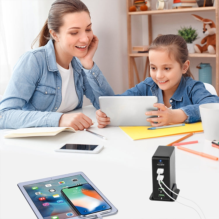 Black 6-in-1 65W PD travel charger charging tablets and phones via USB ports
