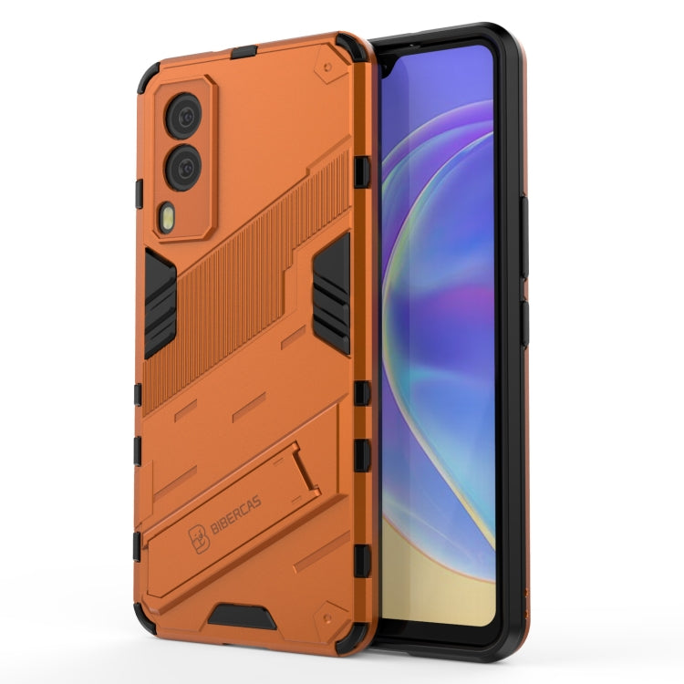 Orange rugged phone case with armor texture, shockproof corners, and camera cutouts