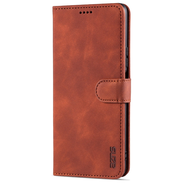 Brown leather flip phone case with card slot and strap, front view.