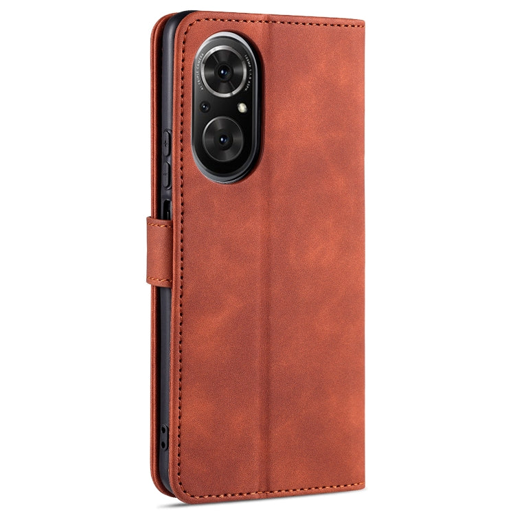 Brown leather flip phone case with camera cutout, back view with strap.