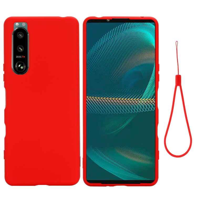 Red liquid silicone phone case with camera openings and hanging lanyard