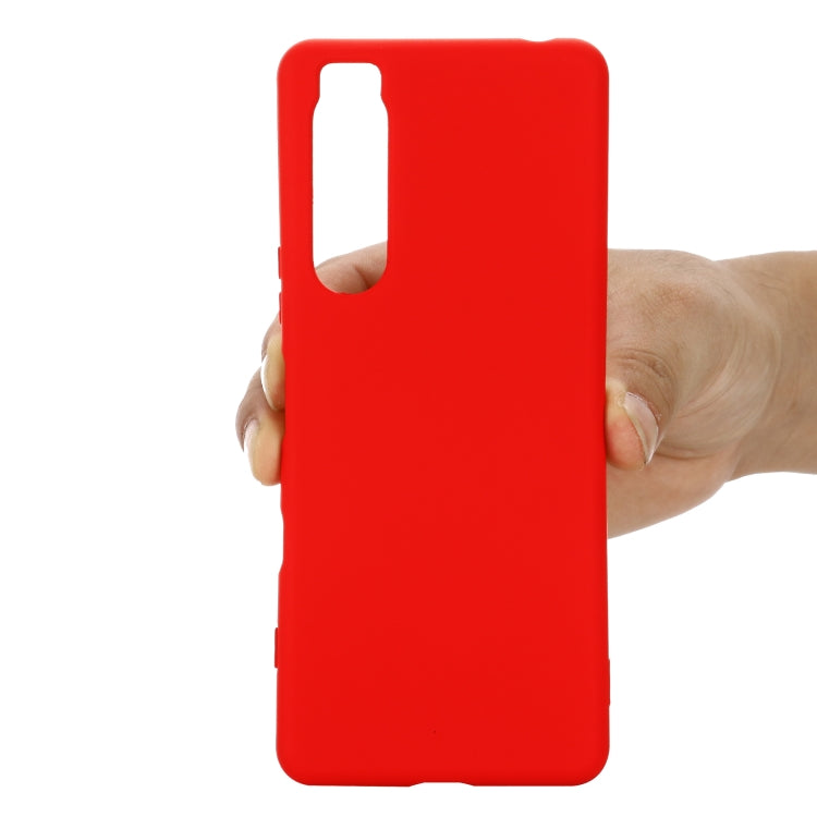 Red liquid silicone phone case with tall top opening and side cutouts