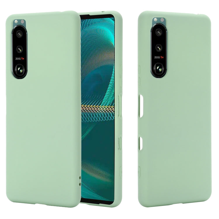 Mint green liquid silicone phone case with full coverage and camera openings