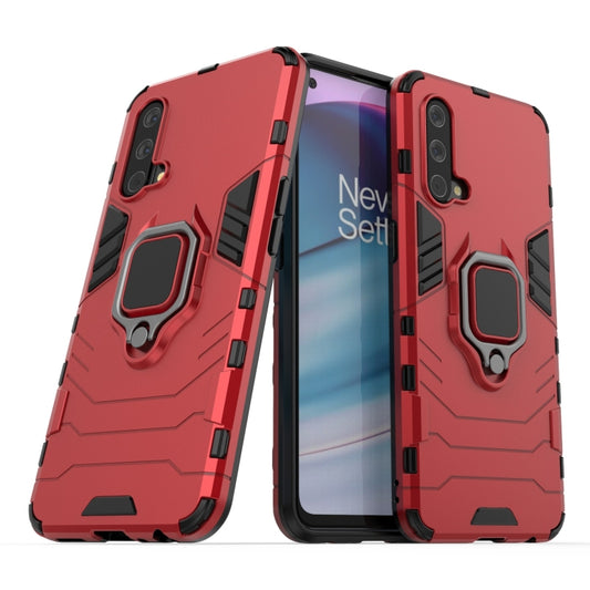 Red shockproof phone case with magnetic ring holder and cutouts for cameras and ports.