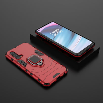 Red rugged shockproof phone case with magnetic ring holder and raised protective edges.