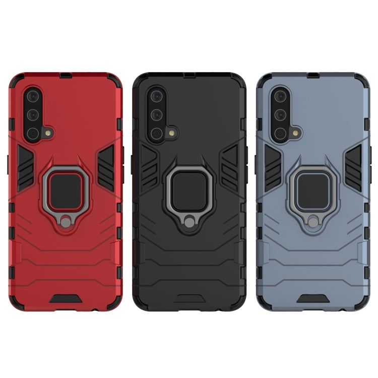 Rugged phone cases in red, black, and navy blue with magnetic ring holder and camera cutouts.