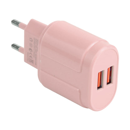 Pink dual-USB travel charger with EU plug and two USB-A ports, angled view