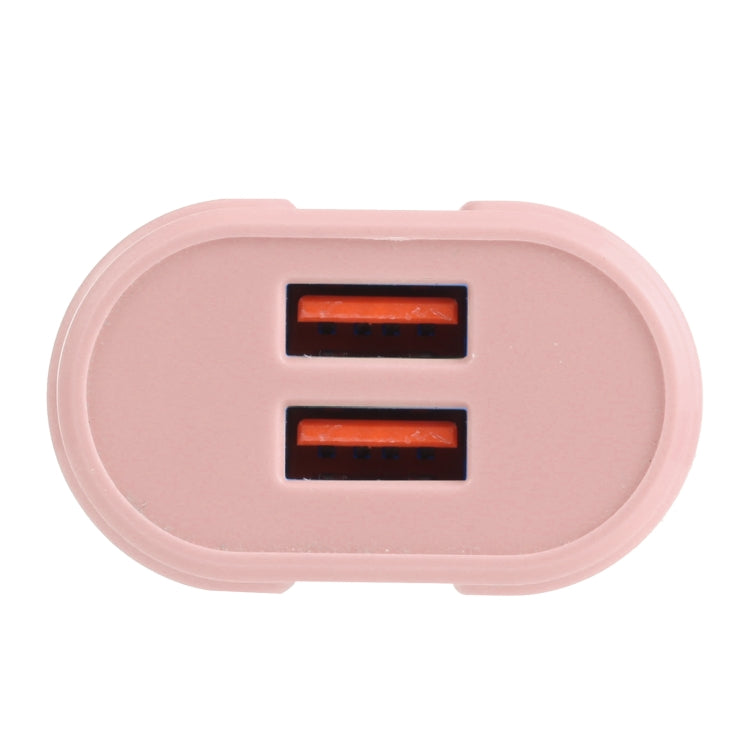 Pink dual-USB charger showing two USB-A ports, EU plug attached