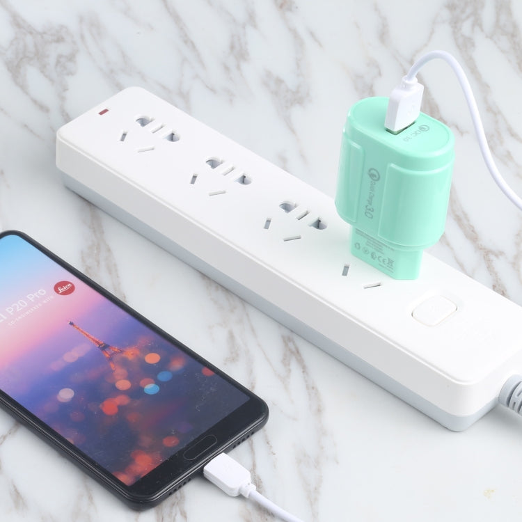 Mint green single-USB travel charger with QC3.0 and USB charging port, with cable.
