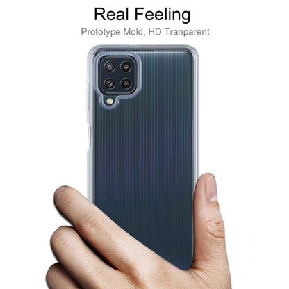 Transparent TPU phone case shown on a hand, with camera and speaker openings