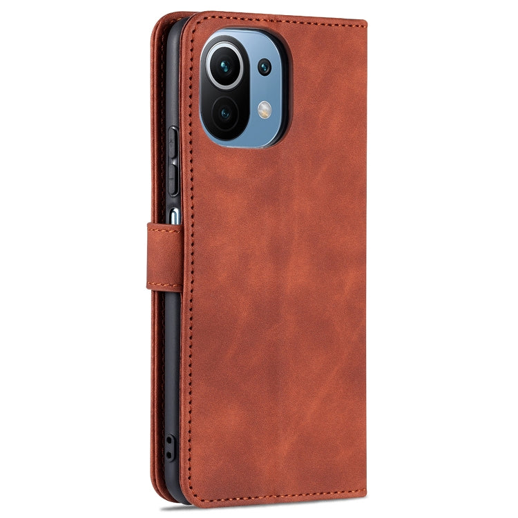 Brown leather flip phone case with camera cutout and side button openings