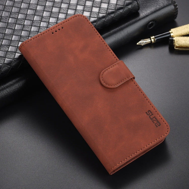 Brown leather flip phone case with card slot flap and stitched edges