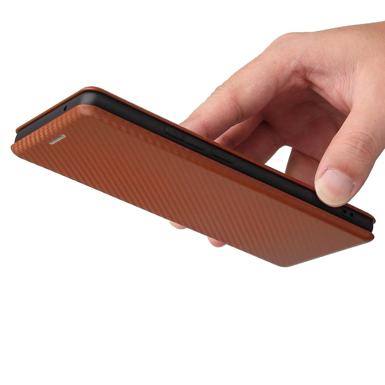 Brown carbon-fiber textured magnetic flip phone case being flipped open by hand