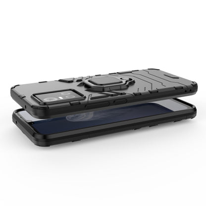 Rugged phone case with magnetic ring holder and raised edges for screen and camera.