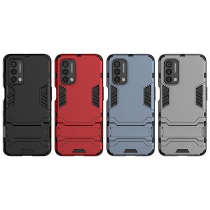 Assorted rugged phone cases in black, red, blue, and grey with button cutouts