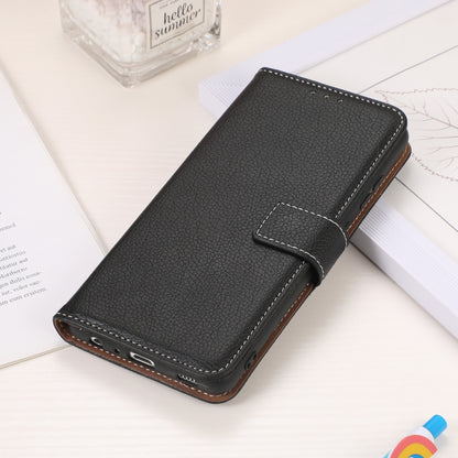 Black textured flip phone wallet case with bottom port cutouts and stitched closure