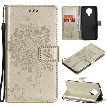 Gold tree and cat pattern flip PU leather phone case with card slots and lanyard holder