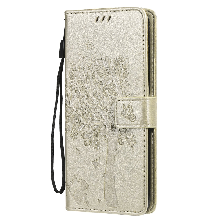 Gold tree and cat pattern flip phone case with front flap and wrist strap