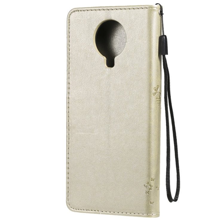 Gold flip PU leather phone case with keyhole cutout and side wrist strap