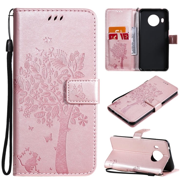 Light pink PU leather phone case with embossed tree, cat, butterfly pattern; card slots, stand; lanyard.