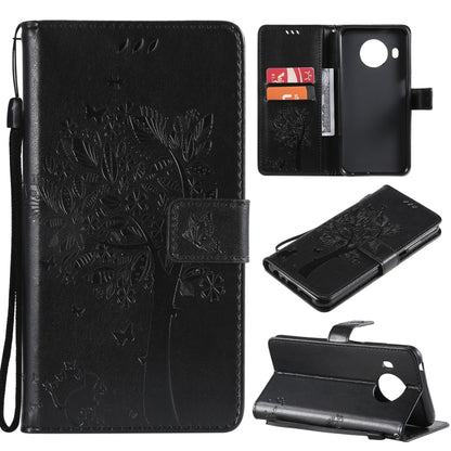 Black PU leather phone wallet case with tree and butterfly embossed pattern, card slots, lanyard.